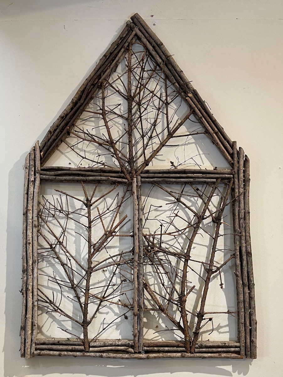 a picture of a window made out of branches